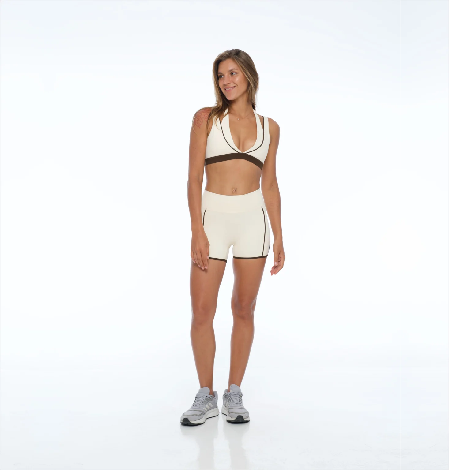 Piped bra and short set in cream, studio shot
